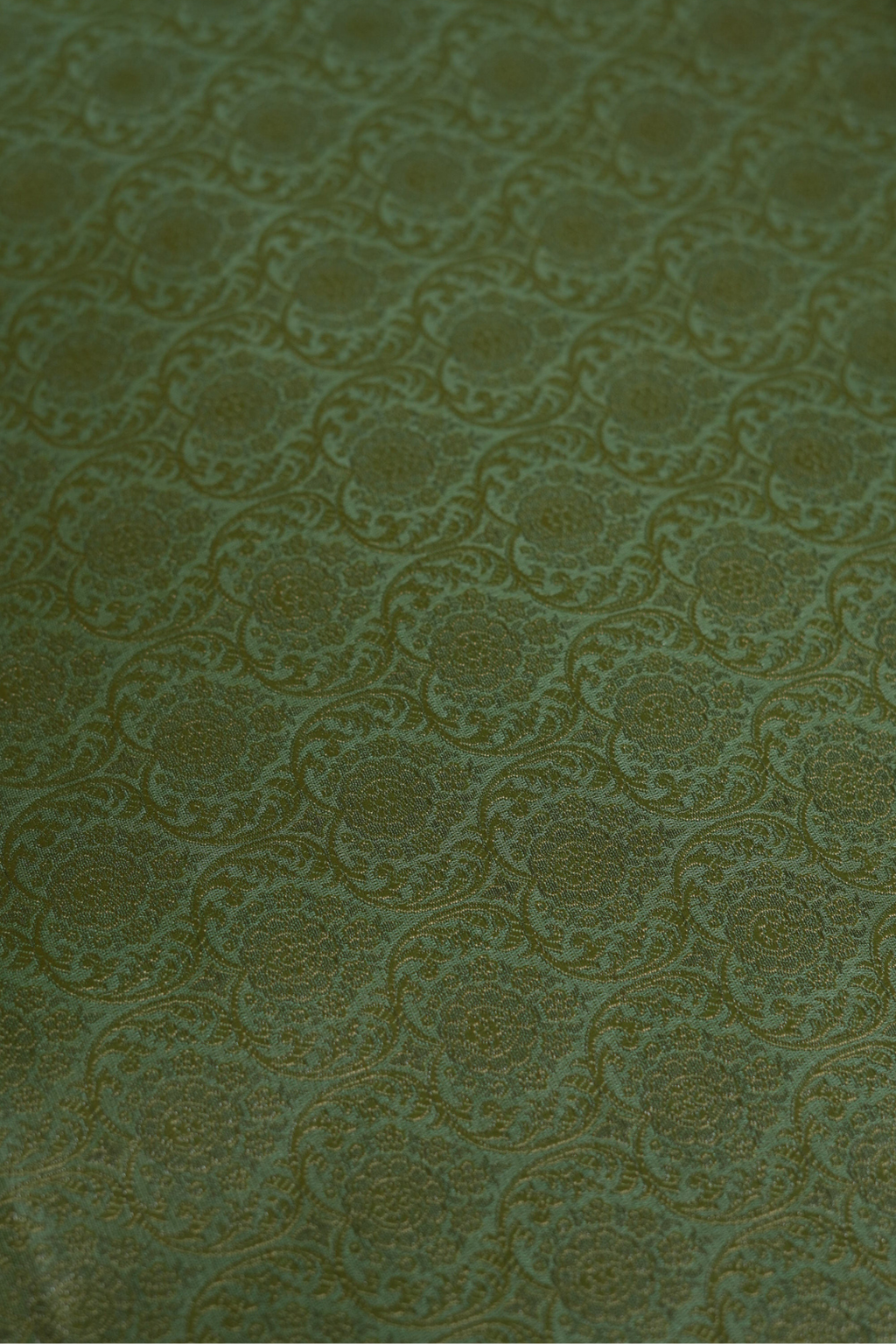 Semi Silk Brocade Fabric in Green with Floral and Paisley Motifs