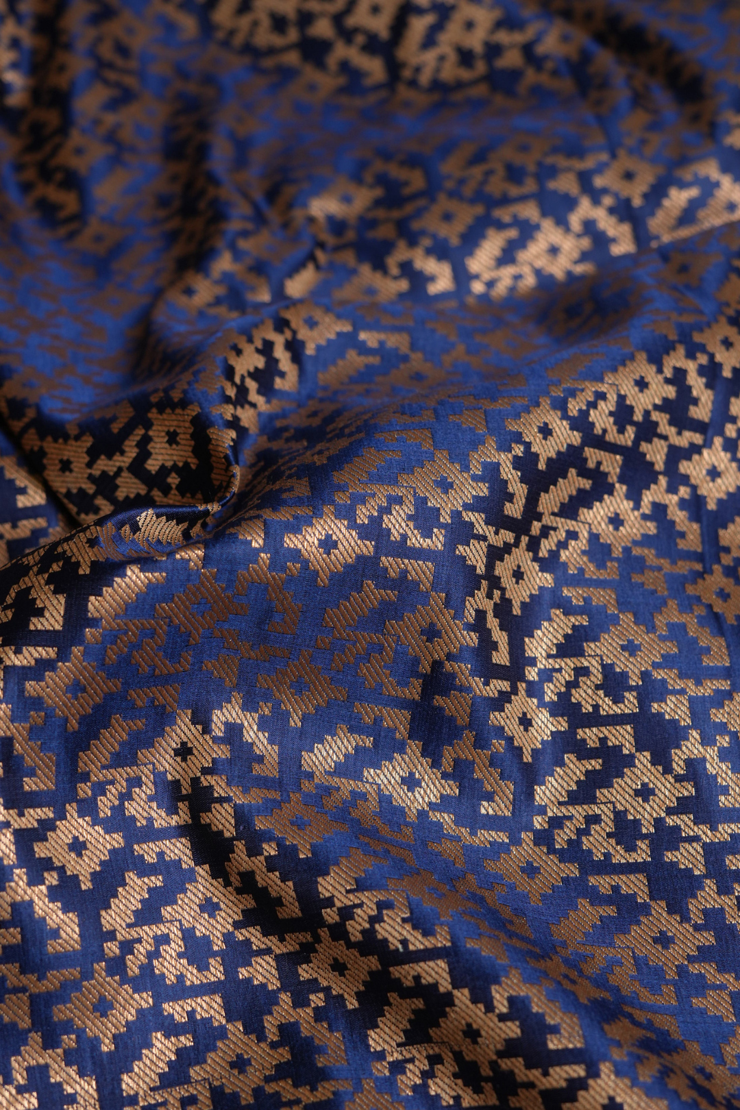 Semi Satin Silk Fabric in Navy Blue with Gold Geometric Motifs
