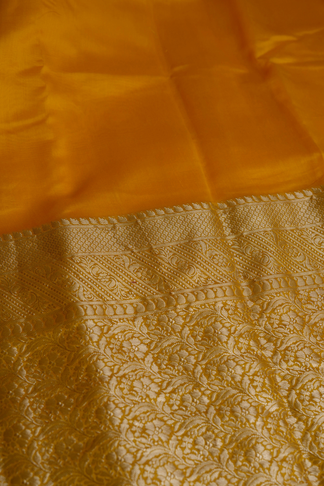 Handwoven Munga Silk Fabric with Gold Floral and Geometric Border