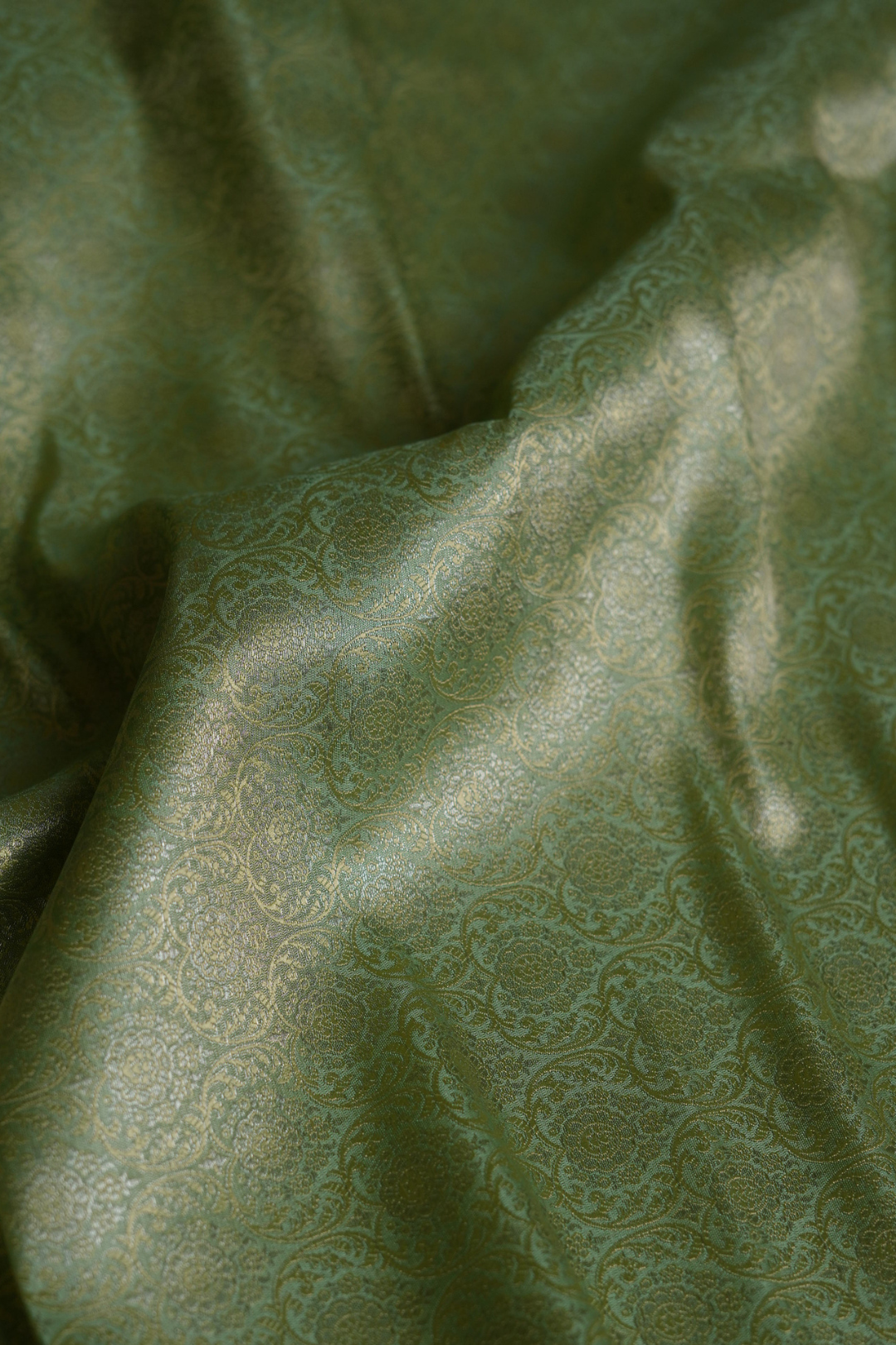 Semi Silk Brocade Fabric in Green with Floral and Paisley Motifs