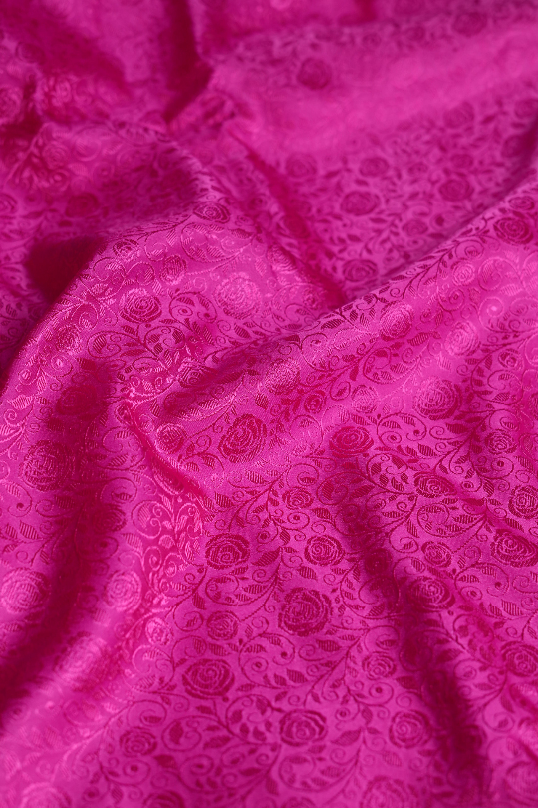 Semi Satin Silk Fabric in Rani Pink with Floral jaal