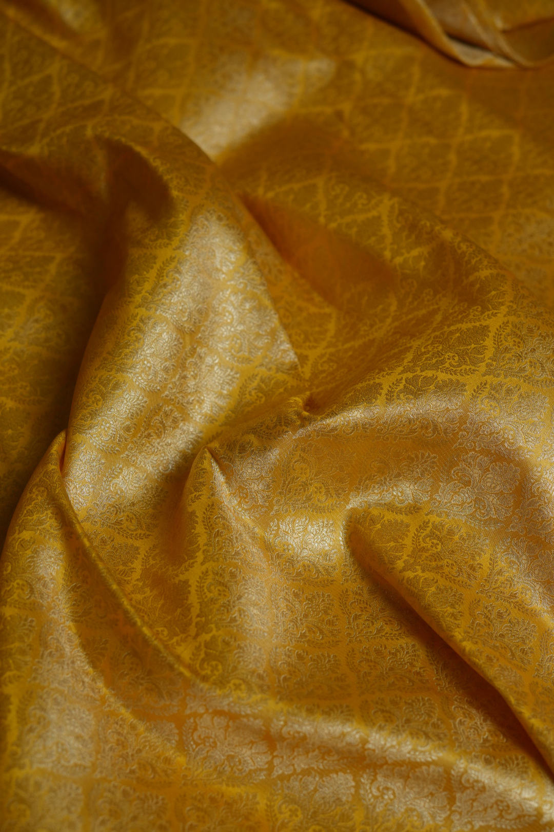Semi Silk Brocade Fabric in Yellow with Floral Motifs
