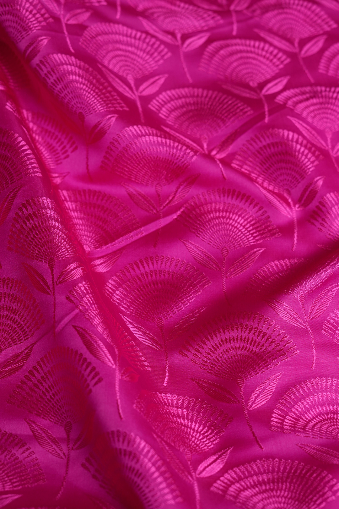 Semi Satin Silk Fabric in Rani Pink with Floral Booti